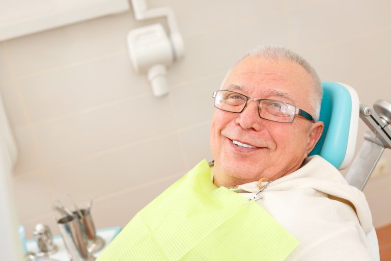 Old,Senior,Man,With,Glasses,Sitting,In,A,Dental,Chair